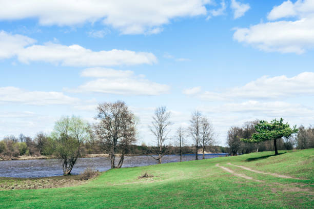 istock Beautiful spring landscape. Blue river and trees on on a sunny day after melting snow. 1148695683