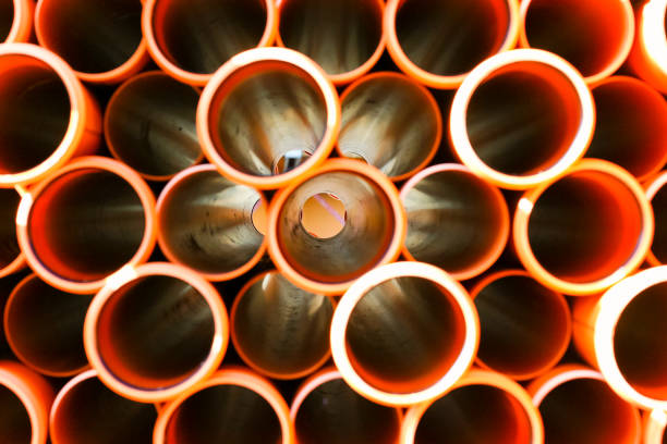 Pile of pvc sewage pipes Pile of pvc sewage pipes pvc conduit stock pictures, royalty-free photos & images