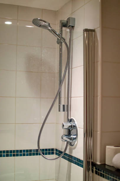 istock Bath hand shower fixture on the wall 1148697911