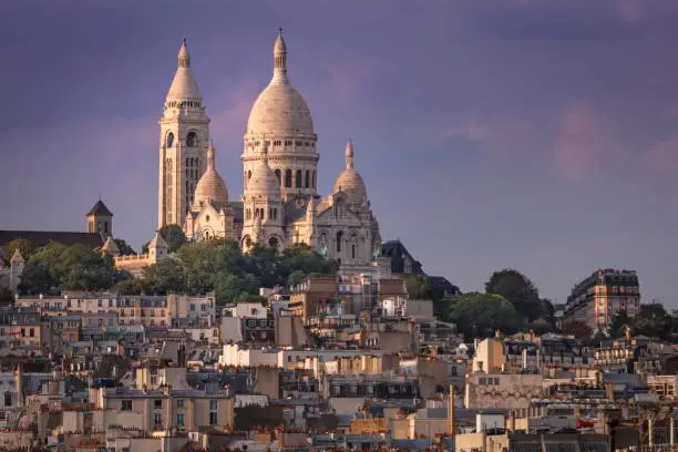 Sacre Coeur and Montmartre from above at gold colored sunset – Paris, France