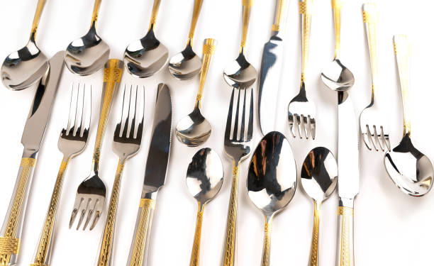 istock Different cutlery - forks, spoons and knives on a white background 1148699615