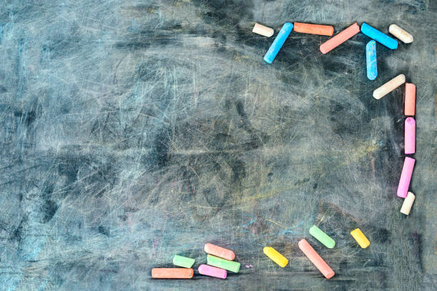 istock Multi-colored chalk by the sides of the board 1148699778