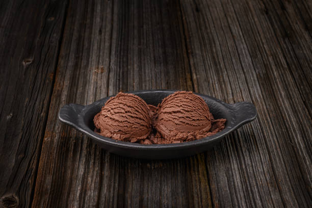 istock Chocolate ice cream with bowl on wooden background 1148700492