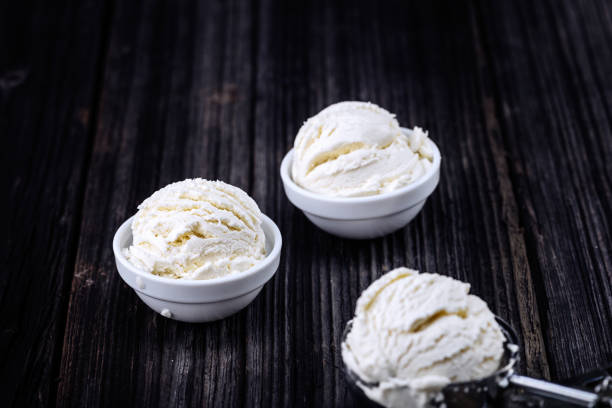 istock Vanilla ice cream with bowl on wooden background 1148700542