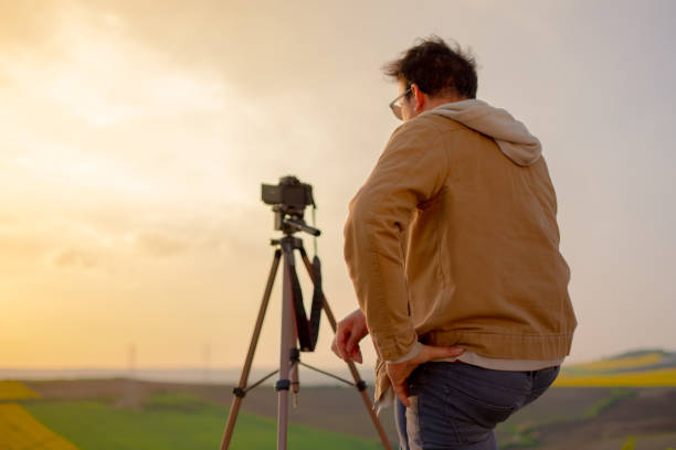 istock cameraman filming the rural scene 1148702450