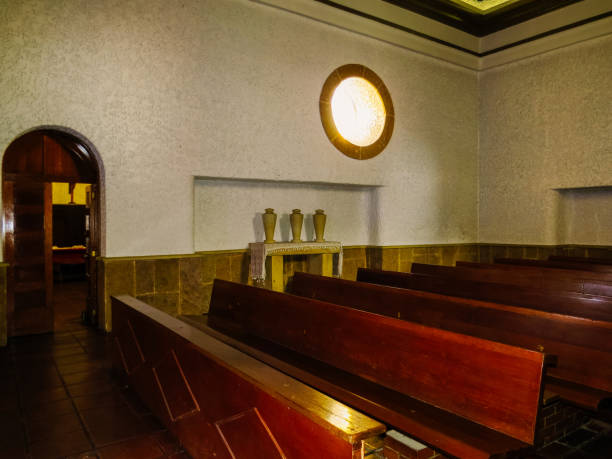 istock Benches in elegant catholic temple 1148710644