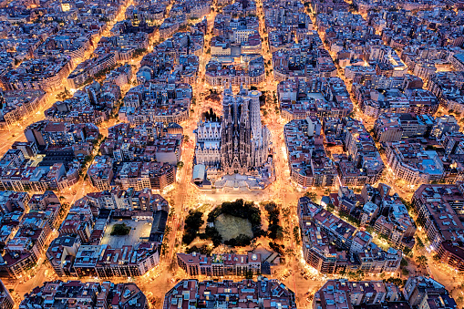 Aerial view of Barcelona with Diagonal Avenue and square blocks and Sagrada Familia