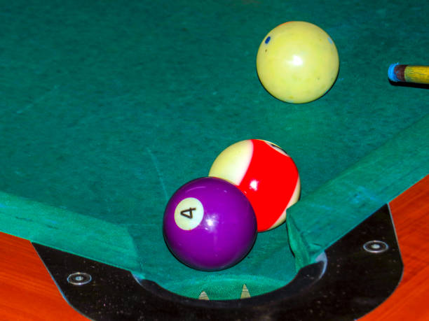istock Pool balls next to the pocket in the table 1148711271
