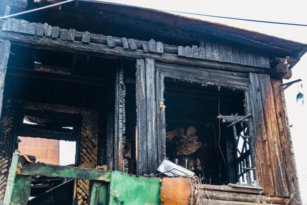 istock Completely burnt wooden house. Consequences of fire 1148712529