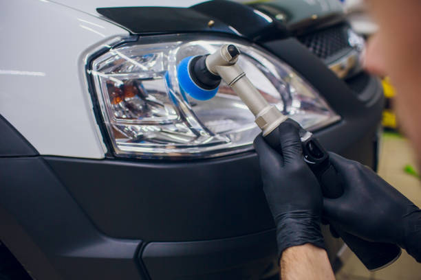 istock auto mechanic buffing and polishing car headlight 1148714732