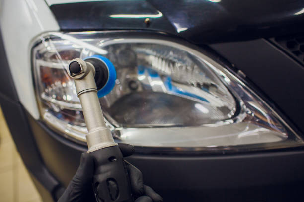 istock auto mechanic buffing and polishing car headlight 1148714773