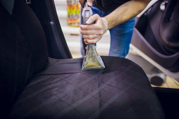 istock Car interior textile seats chemical cleaning with professionally extraction method. 1148715497