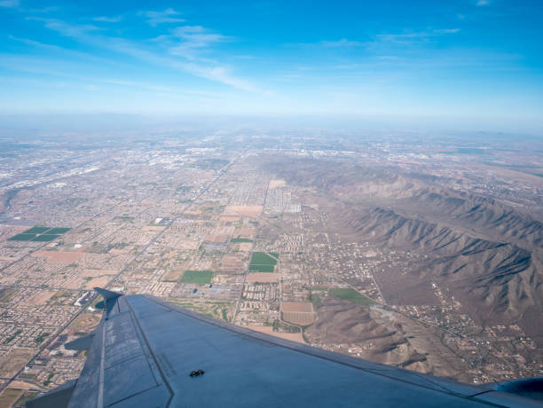 istock Airplane Flying Over Phoenix Area Mountains 1148715709