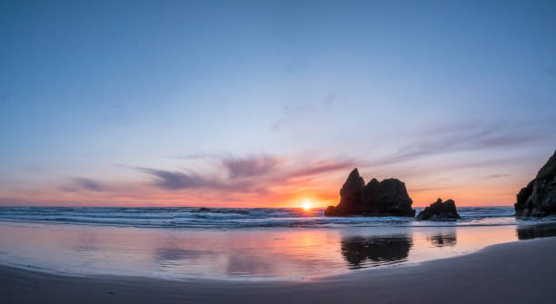 istock Wide Angle Panorama of Sun Hidden Behind Large Rock 1148715796