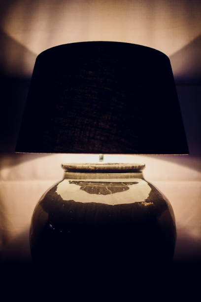 istock Lamp night light in a dark background. Vintage effect style picture. 1148716378