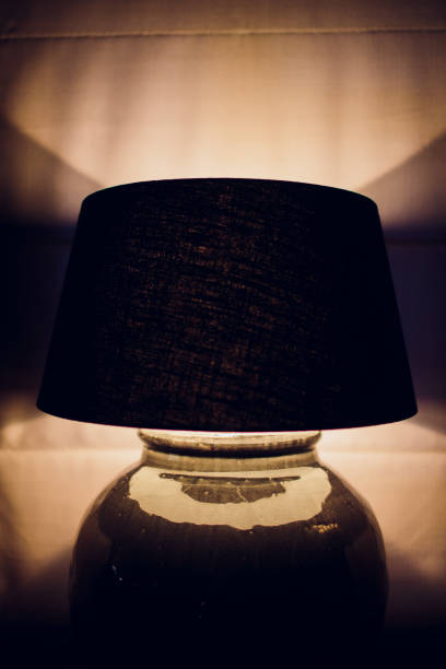istock Lamp night light in a dark background. Vintage effect style picture. 1148716392