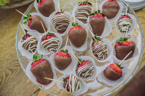 istock Chocolate dipped strawberries at dessert bar. 1148716450
