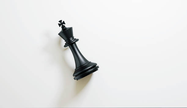 single king chess piece on white background - chess king chess chess piece black stock-fotos und bilder