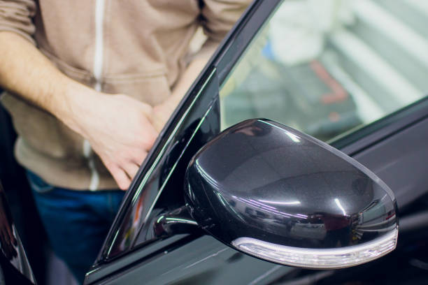 istock Car mirror man repair,Car accident broken side mirror. 1148717514