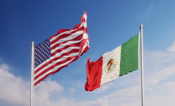 istock American and Mexican Flags Waving at Different Directions  Over Blue Sky 1148718815