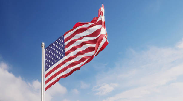 istock American Flag Waving With Wind Over Blue Sky 1148721015