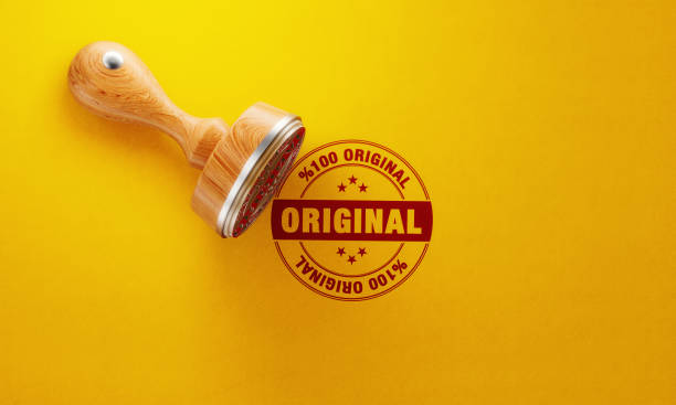 istock Wooden Original Stamp On Yellow Background 1148721080