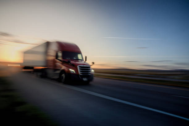 istock Long Haul Semi Truck on a Highway at Dusk under a Dramatic Sky 1148727734