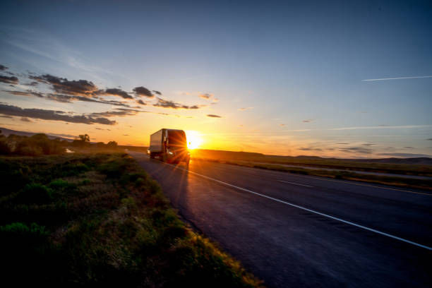 istock Long Haul Semi Truck on a Highway at Dusk under a Dramatic Sky 1148727776