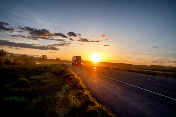 istock Long Haul Semi Truck on a Highway at Dusk under a Dramatic Sky 1148728311