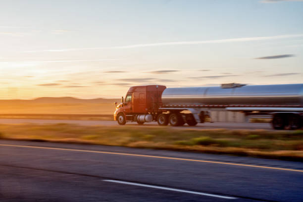 istock Long Haul Semi Truck on a Highway at Dusk under a Dramatic Sky 1148728334
