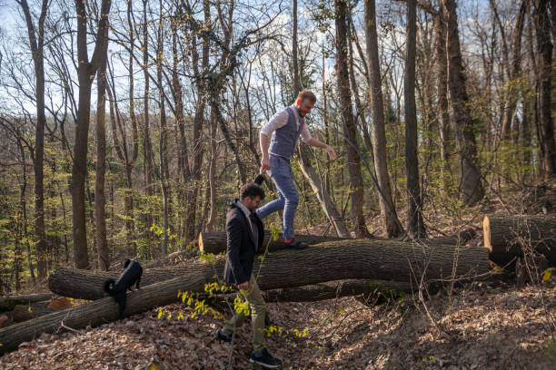 istock two men, gay couple holding hands, helping each other. 1148730205