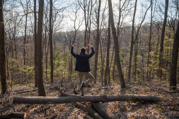 istock dancer in smart casual clothing, doing ballet pose. outdoors in woods. 1148730330