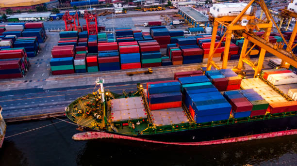 istock Logistics and transportation of Container Cargo ship and Cargo plane with working crane bridge in shipyard, logistic import export and transport industry background 1148731996