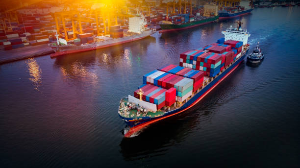 istock Logistics and transportation of Container Cargo ship and Cargo plane with working crane bridge in shipyard at sunrise, logistic import export and transport industry background 1148732004