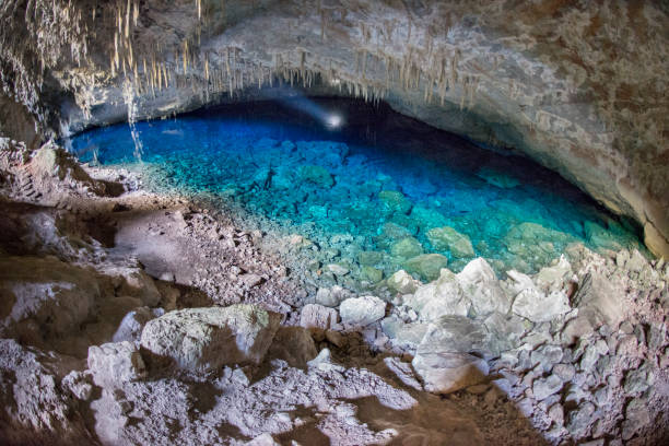 Blue lake grotto Natural Monument in Bonito Gruta do Lago Azul natural monument in Bonito, Mato Grosso do Sul. Cave with water on a blue lake illuminated with a flashlight. grotto cave photos stock pictures, royalty-free photos & images
