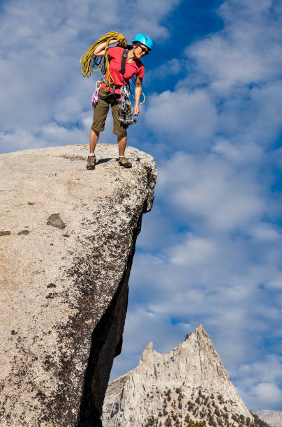 istock Climber on the edge of a challenging cliff. 1148733082