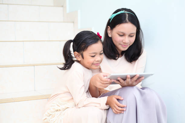 Muslim Kid Using Tablet 110+ Teenage Muslim Girl Using Tablet Computer Stock Photos, Pictures ...
