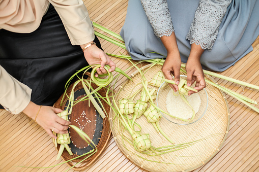 Ketupat weaving for Hari Raya Aidilfitri / Eid-Ul-Fitr by the women folk n Malaysia.