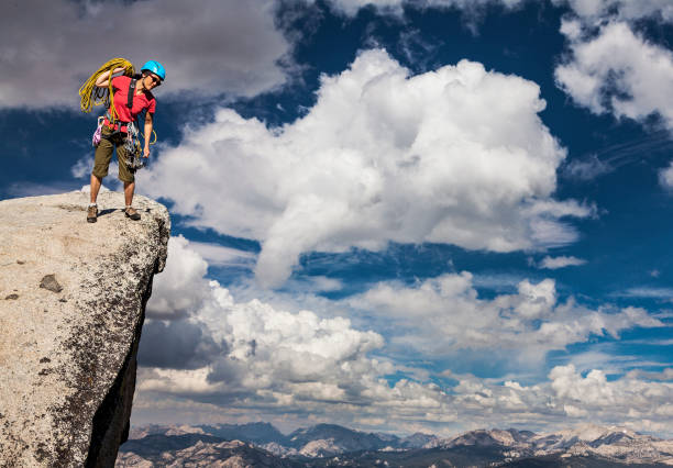 istock Climber on the edge of a challenging cliff. 1148733804