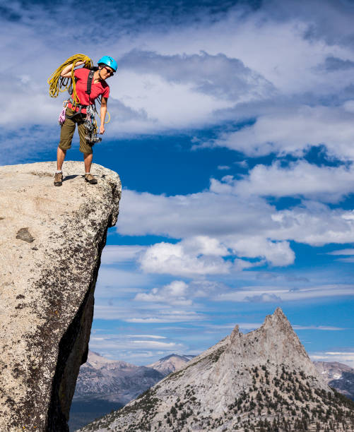 istock Climber on the edge of a challenging cliff. 1148733822