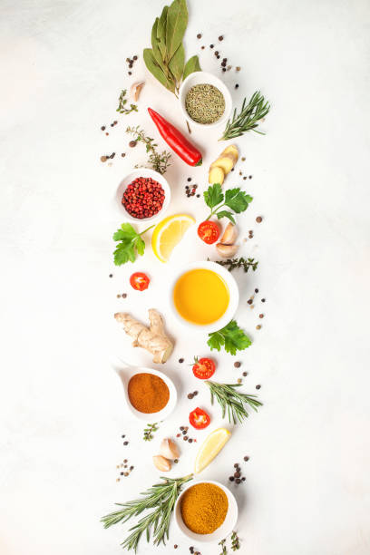 istock Herbs and spices over light stone background. Top view. Copy space 1148735140