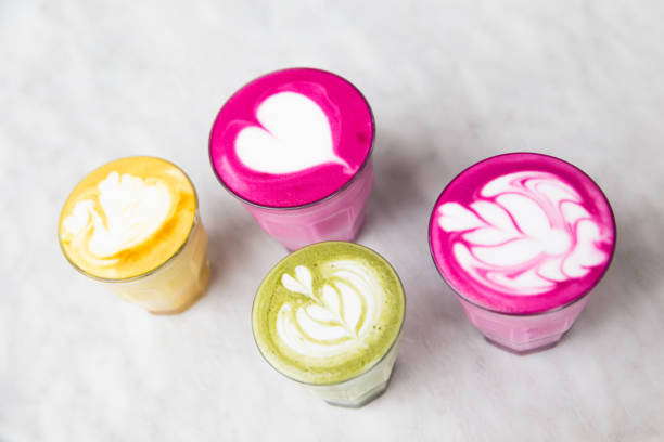 istock Glasses of beetroot, matcha,turmeric latte on marble table background. 1148736147