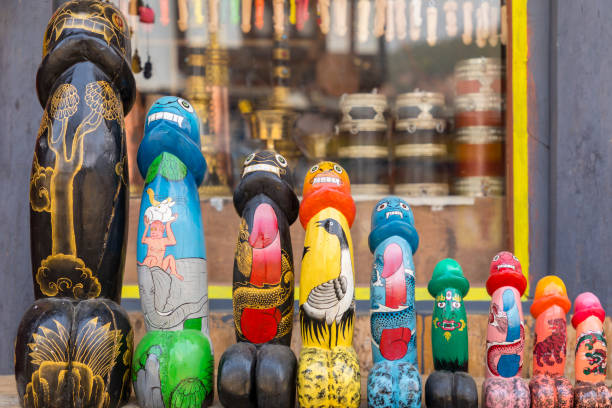 Phallic carvings for sale in the village of Sopsokha near Chimi Lhakhang. This penis fascination has a strong historic and spiritual significance in Bhutan and there is a long tradition of worshipping the phallus. Nowadays carved penises are for sale to tourists in the Punakha area phallus shaped stock pictures, royalty-free photos & images