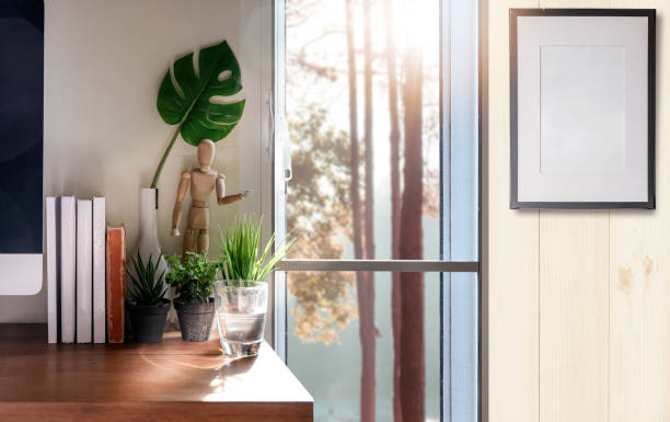 istock home office with desktop computer, books and houseplant. 1148737509