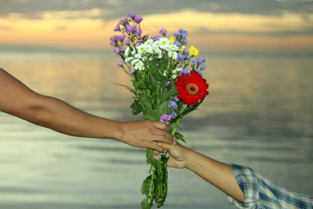 istock Marriage Proposal with Flowers Bouguet 1148737799