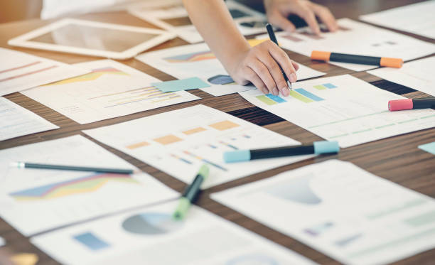 istock Shot of man hand working with graph or chart document at office. 1148737910