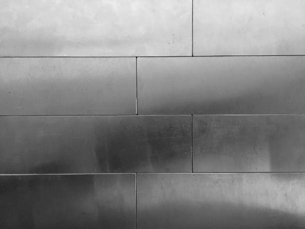 istock Shiny silver plate connect as brick on the wall 1148739603