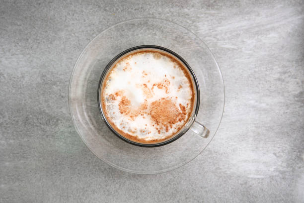 istock hot dry cappuccino in a cup on a grey background 1148739651