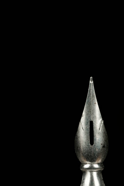 Macro image of a pen nib against a black background