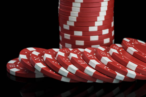 istock red poker chips stacked close-up on a black background 1148742440